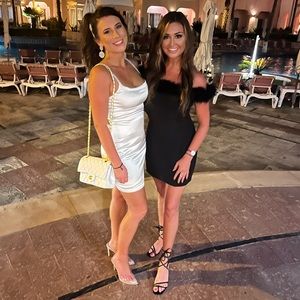 Gianni Bini black feather mini off shoulder dress. Crepe sheath material.